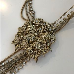Butterfly necklace layered w/beads, pearls, bling